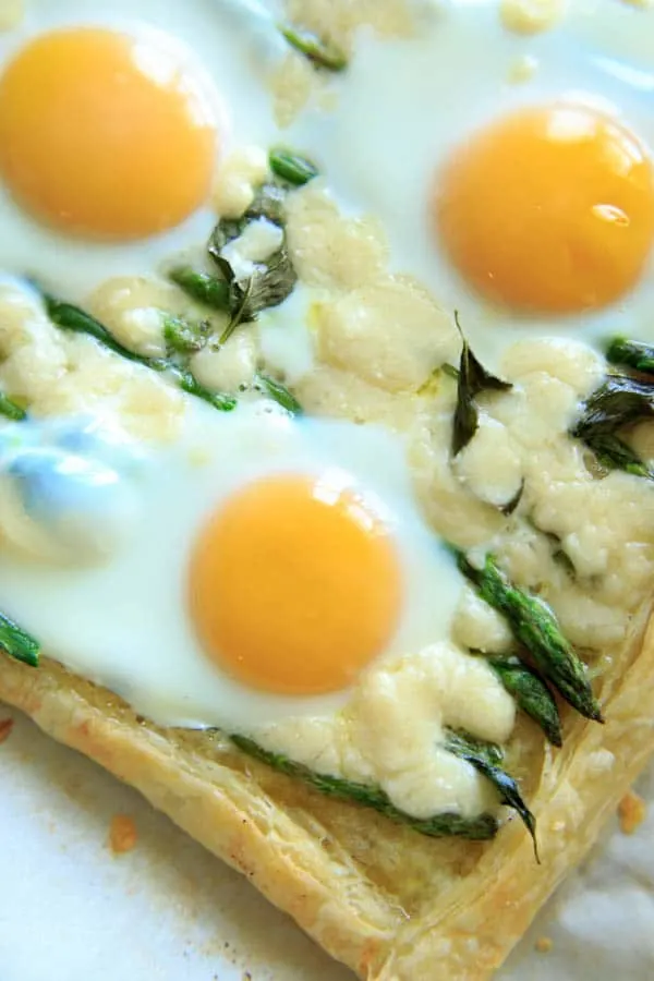 close-up of Asparagus Tart with Egg and Goat Cheese (on puff pastry)