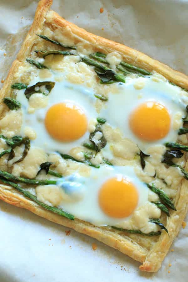 One sheet of puff pastry with asparagus, eggs and goat cheese 