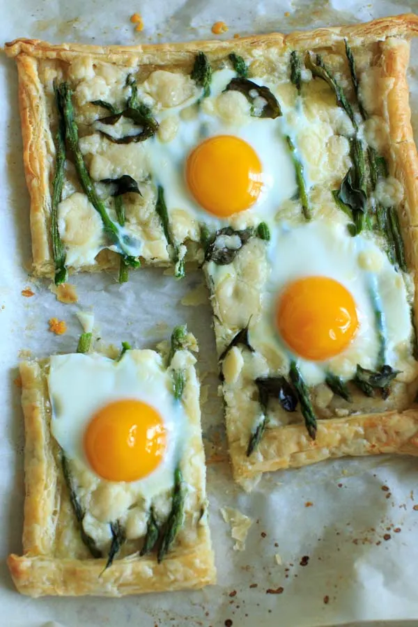 Asparagus Tart with Egg and Goat Cheese with a slice cut