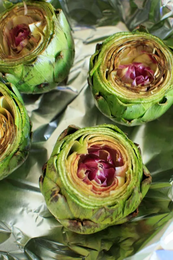 Lemon Garlic Roasted Artichokes - a simple and different way to cook this veggie side dish. Serve with melted butter or other favorite dip!