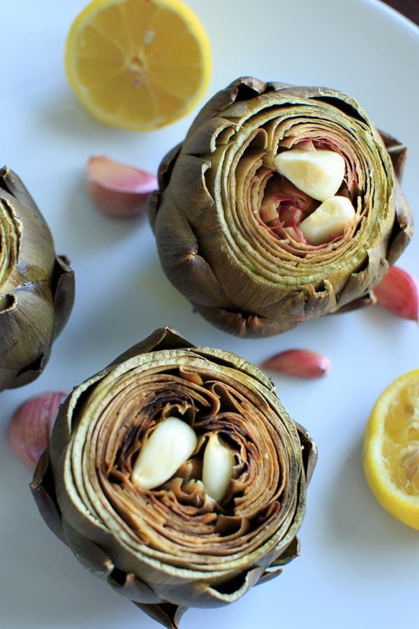 Lemon Garlic Roasted Artichokes - a simple and different way to cook this veggie side dish. Serve with melted butter or other favorite dip!