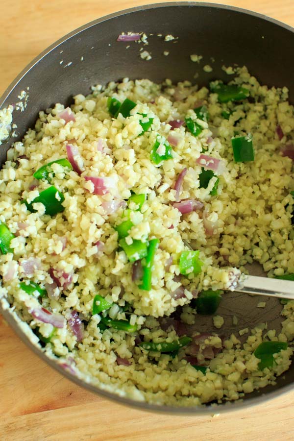 Riced cauliflower with green peppers and spices. This low-carb, healthy side dish is completely customizable and will be ready in 15 minutes!
