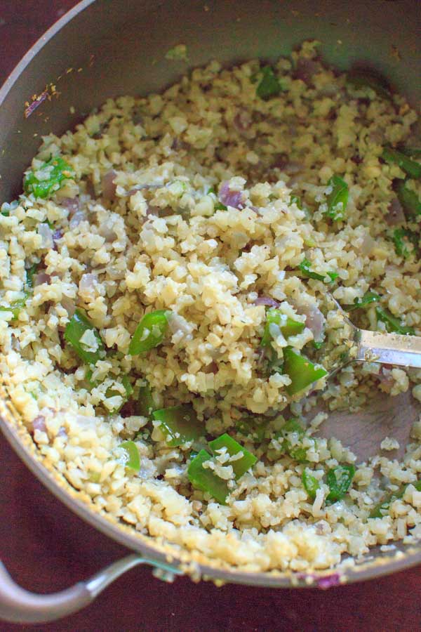 Riced cauliflower with green peppers and spices. This low-carb, healthy side dish is completely customizable and will be ready in 15 minutes!