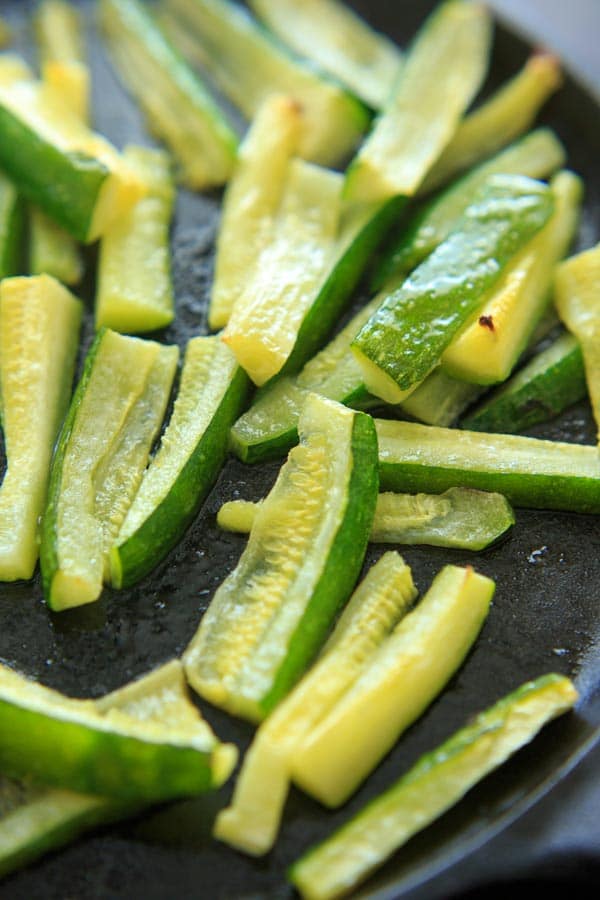 Baked Zucchini with Truffle Oil is the perfect easy side dish! Delicious and quick way to eat up your zucchini crop.