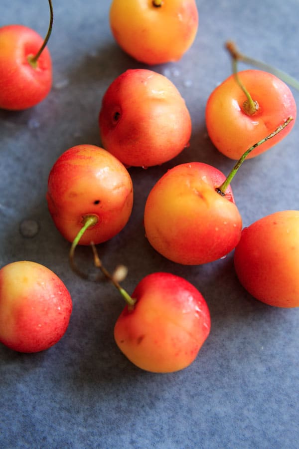 a handful of washed cherries on wax paper