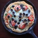 Homemade Pizza with Truffle Oil, Pear, Black Olives. A sweet and salty combo to give pizza night a unique and delicious spin.