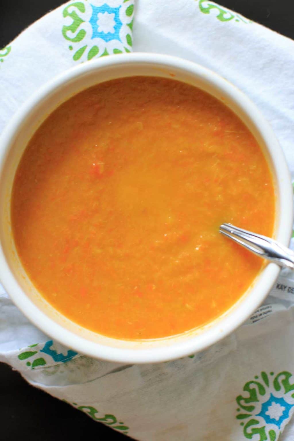 bowl of Carrot and Leek Soup with decorate white napkin 