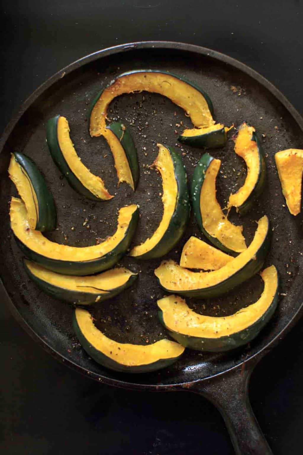 roasted acorn squash on cast iron skillet