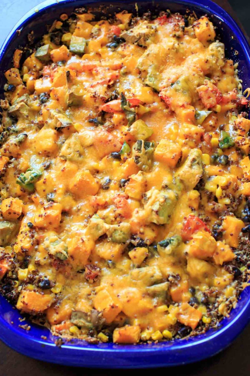 squash casserole in blue baking dish