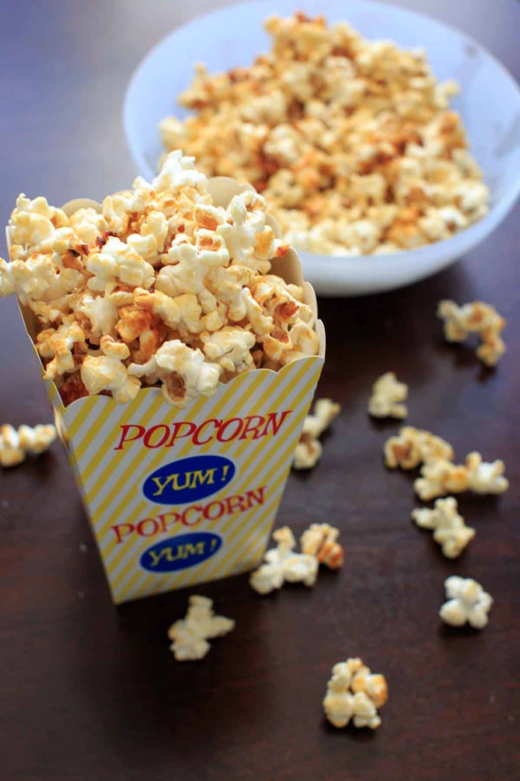 kettle corn in popcorn box and bowl on table