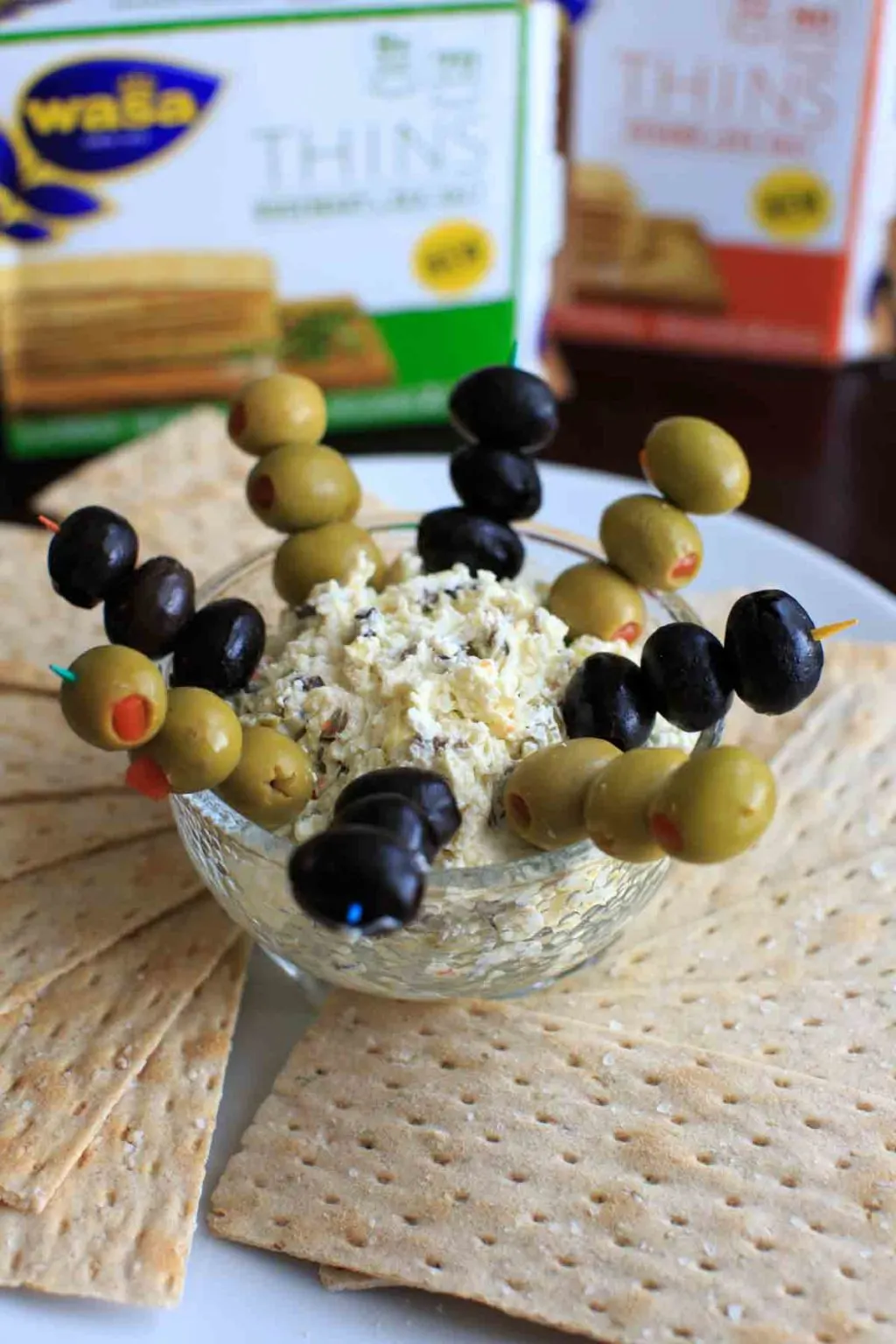 Olive goat cheese dip is a quick and simple appetizer that can be prepared ahead or on the spot. Sure to be a crowd pleaser!