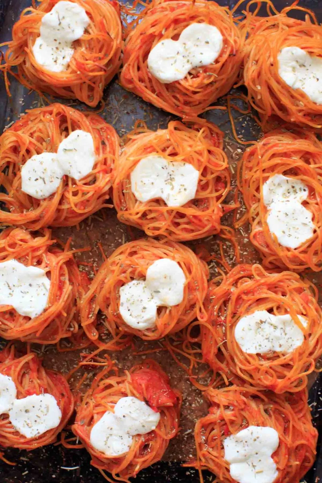 angel hair nests topped with spices and cheese