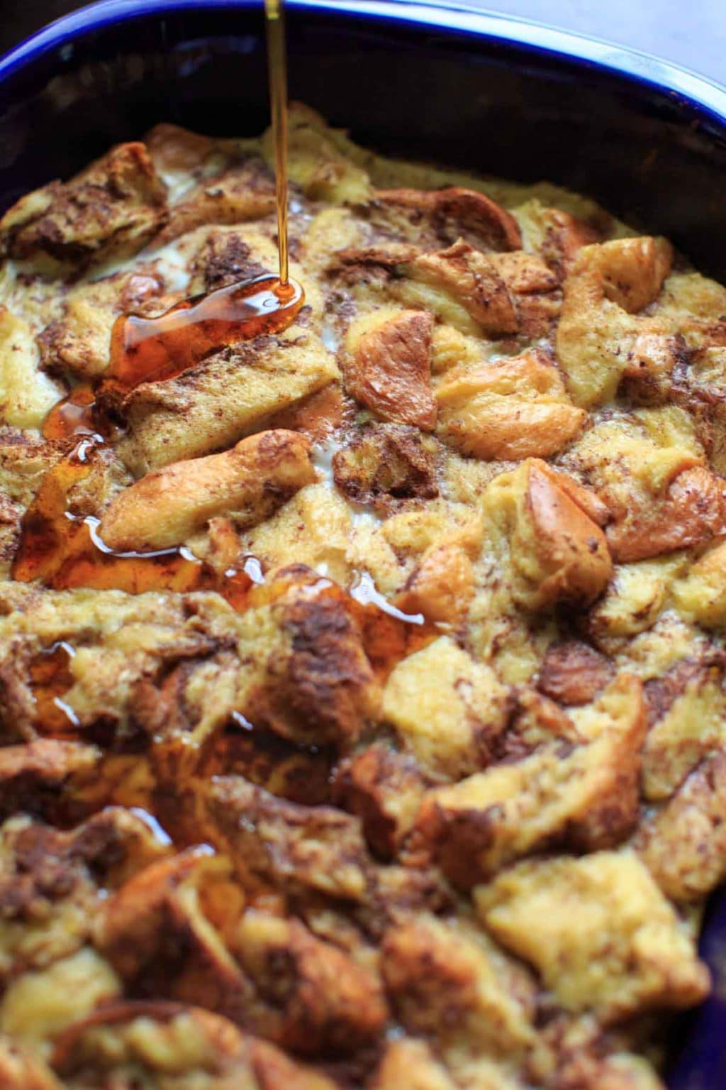 pouring syrup on french toast casserole