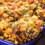 Butternut squash and other vegetables mixed together with quinoa makes a delicious vegetarian, gluten-free, and vegan friendly casserole for the whole family.