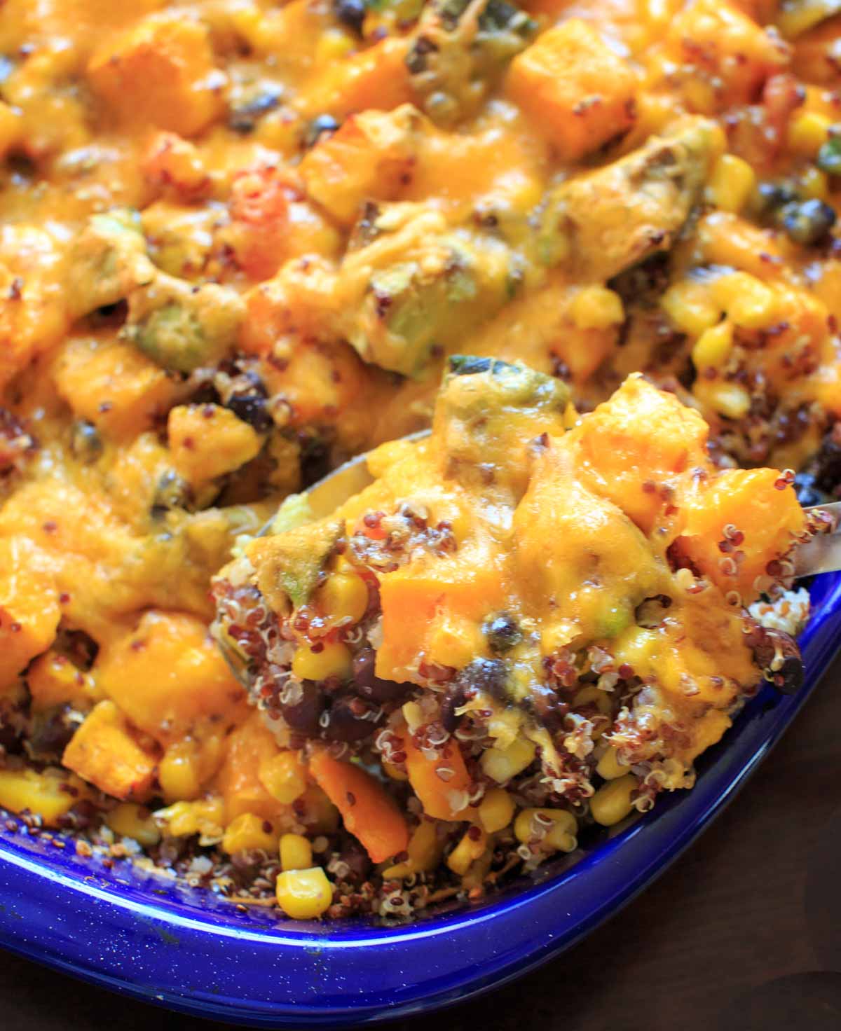 Butternut squash and other vegetables mixed together with quinoa makes a delicious vegetarian, gluten-free, and vegan friendly casserole for the whole family.