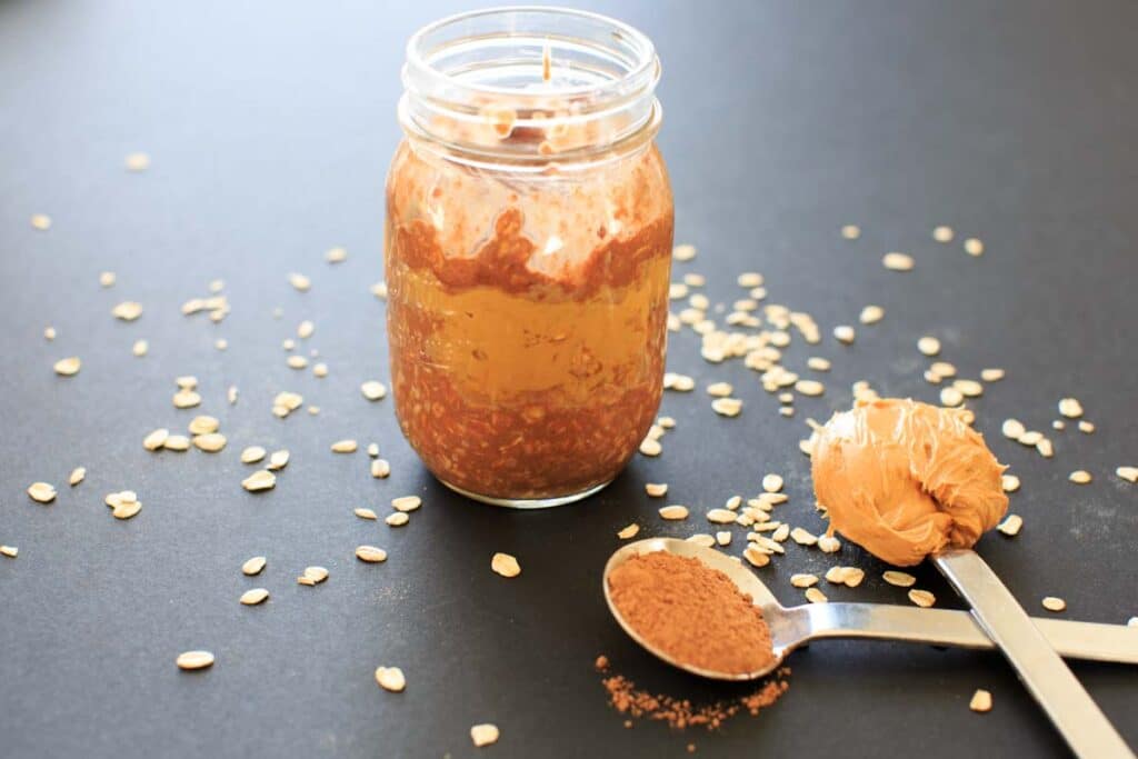 Peanut Butter Chocolate Overnight Oats - a vegan, gluten-free, healthy breakfast that will feel more like dessert than breakfast. Sweetened with maple syrup, no added sugar. Made in partnership with @Silk #ad