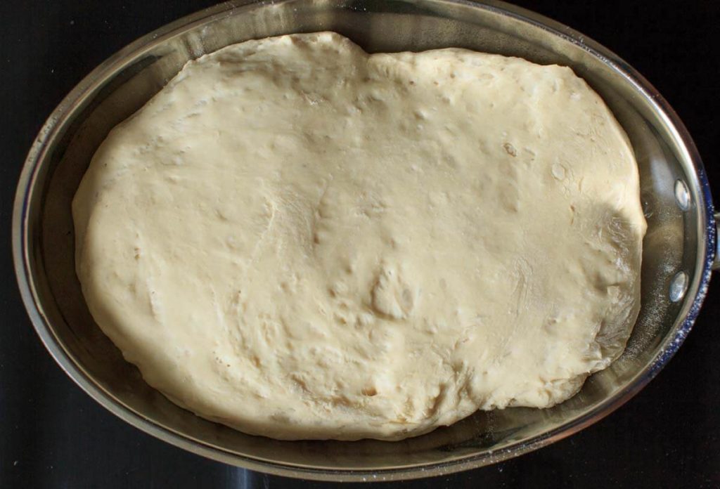 Garlic Herb Focaccia Bread plain dough in baking pan