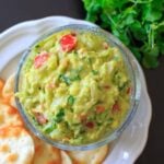 The BEST EVER guacamole recipe that's a little spicy, full of flavor and naturally vegan and gluten-free. Includes tips on how to make it your own if you need to modify.