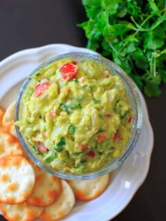 The BEST EVER guacamole recipe that's a little spicy, full of flavor and naturally vegan and gluten-free. Includes tips on how to make it your own if you need to modify.
