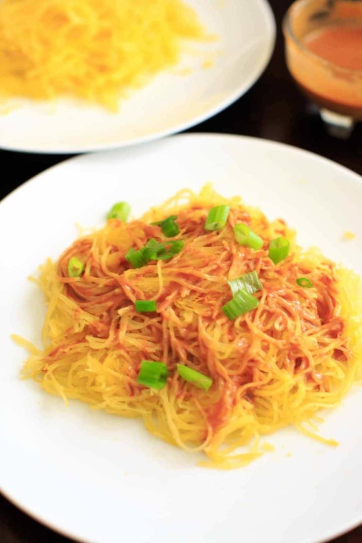 Spaghetti squash noodles and spicy peanut sauce make a delicious, gluten-free and vegan dinner that's easy to prepare!