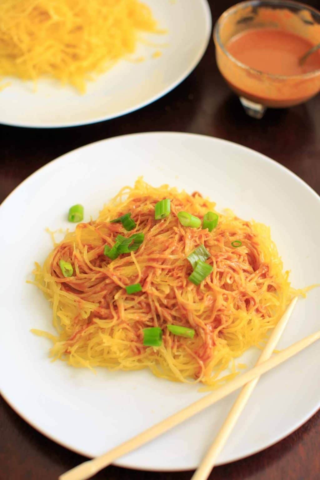 Spaghetti squash noodles with spicy peanut sauce make a delicious, gluten-free and vegan dinner that's easy to prepare!
