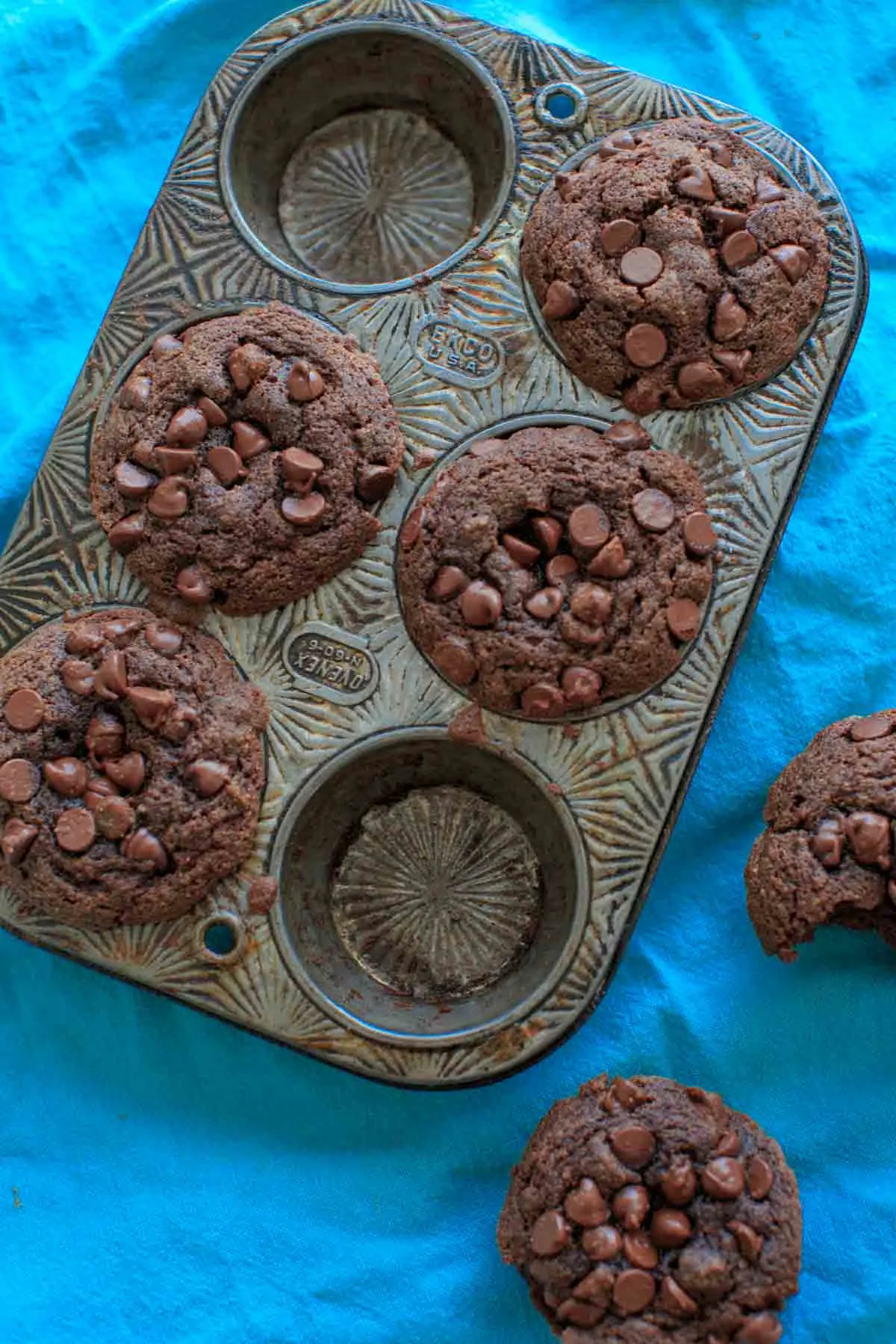 4 Double Chocolate Coconut Flour Muffins in muffin pan