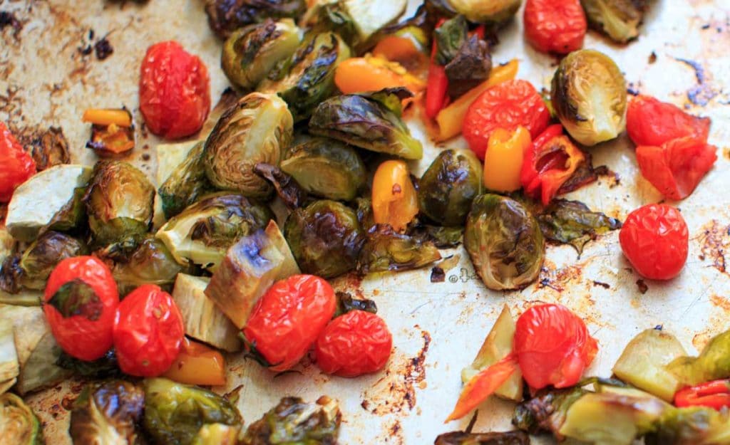 Roasted Vegetable Spinach Salad with Avocado Dressing, a.k.a. "Leftover Veggie Salad." Use up your vegetables or roast your favorites for this healthy vegan meal!