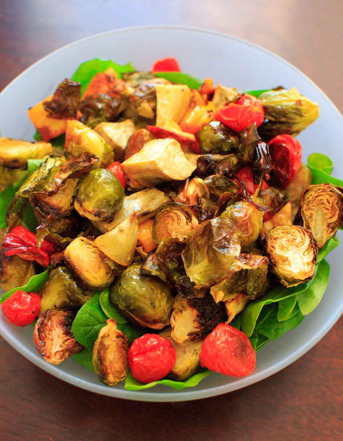 Roasted Vegetable Spinach Salad with Avocado Dressing, a.k.a. "Leftover Veggie Salad." Use up your vegetables or roast your favorites for this healthy vegan meal!