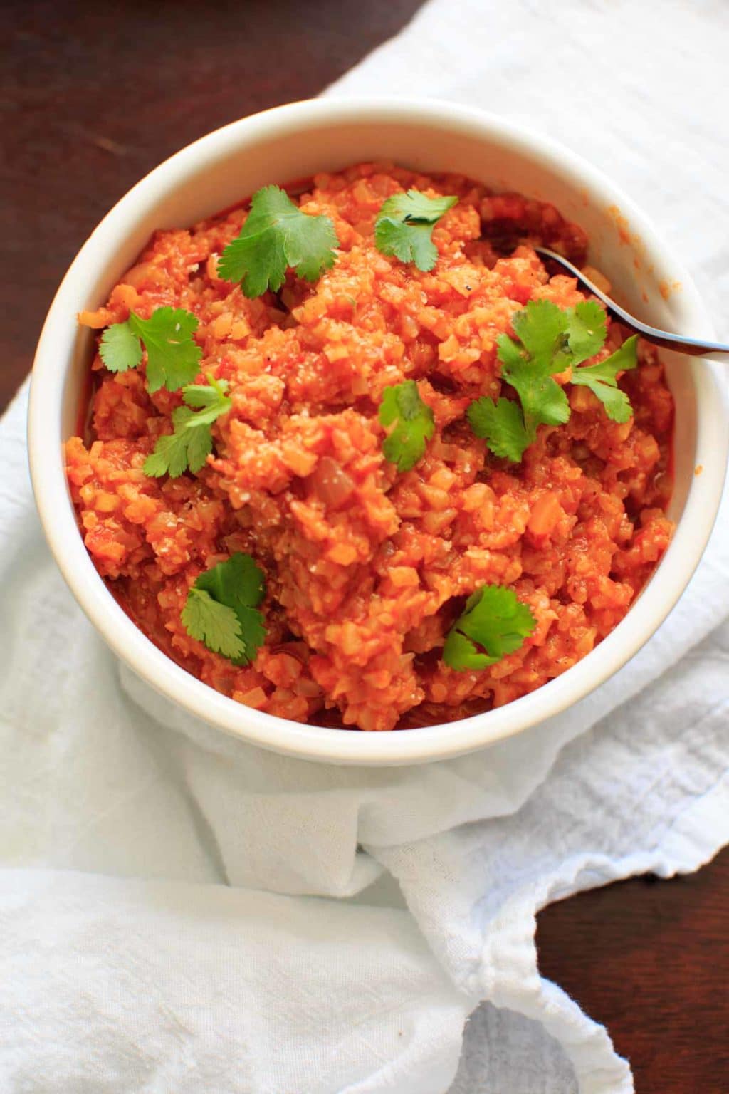 Spanish Cauliflower Rice - a grain-free substitute for Spanish rice that's quick and healthy. Vegan and gluten-free option.