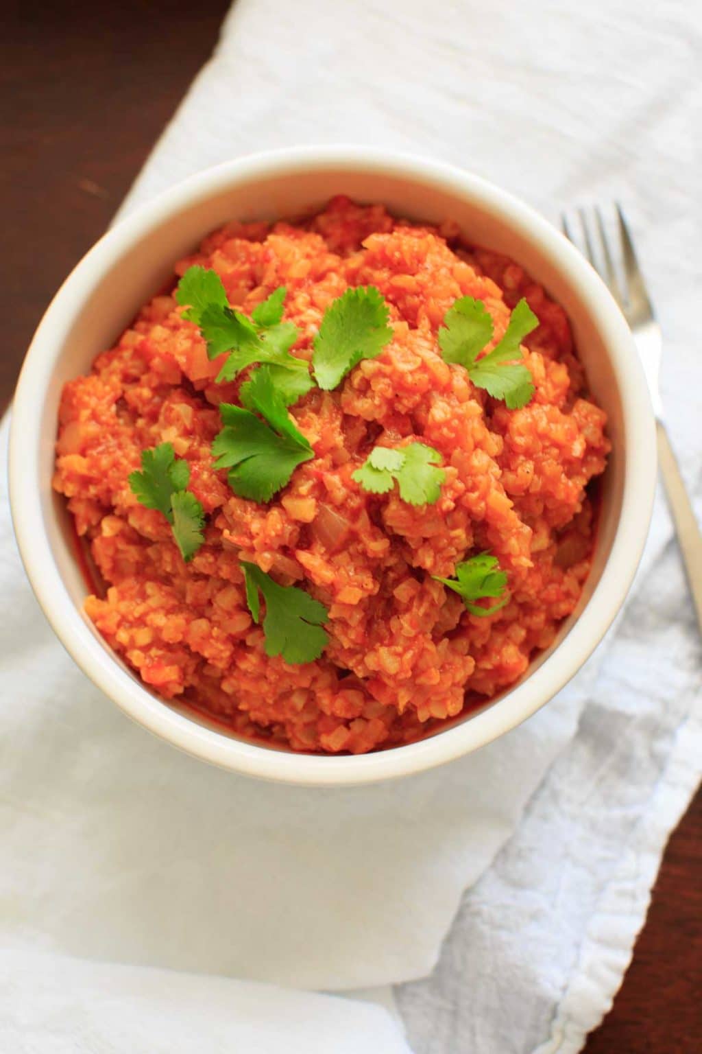 Spanish Cauliflower Rice - a grain-free substitute for Spanish rice that's quick and healthy. Vegan and gluten-free option.