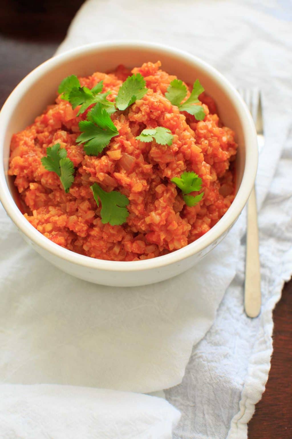 Spanish Cauliflower Rice - a grain-free substitute for Spanish rice that's quick and healthy. Vegan and gluten-free option.