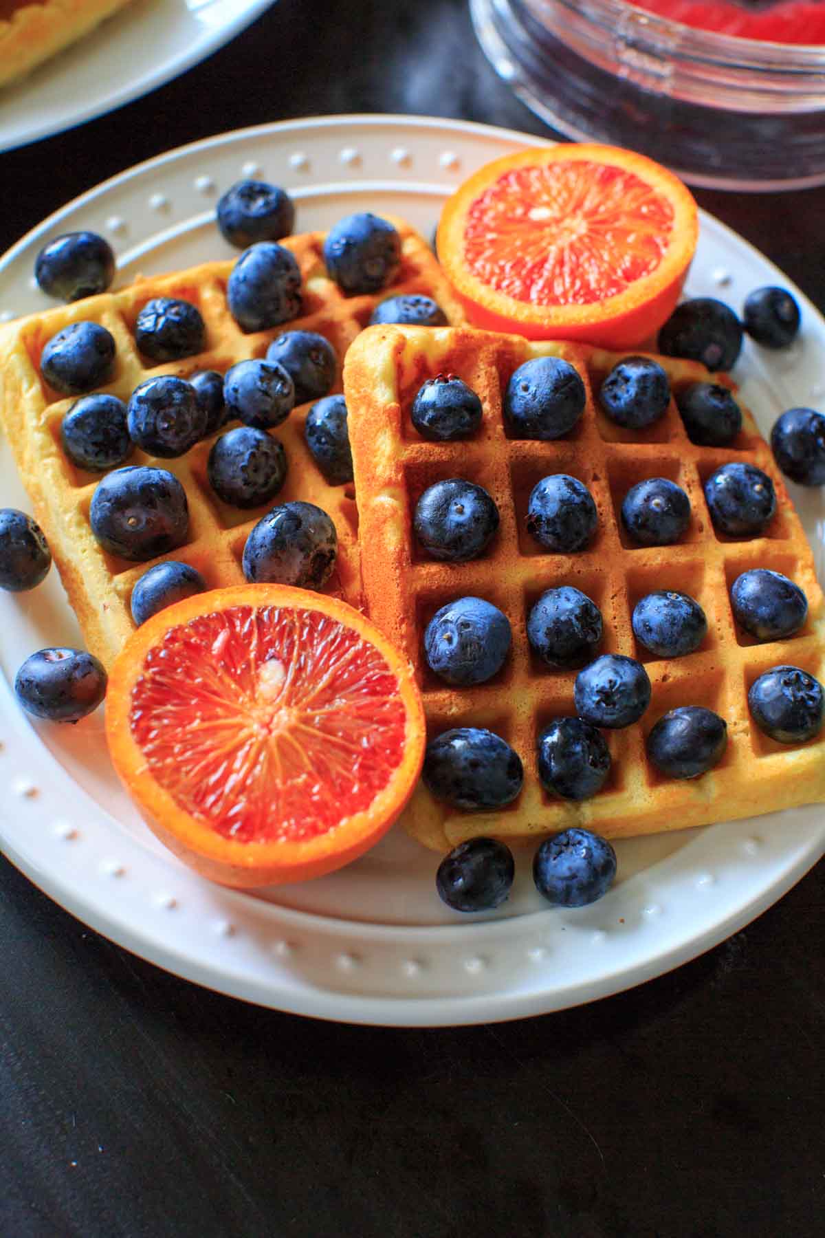 Belgian Waffles made healthy with split red lentils, blood orange juice and blueberries. Breakfast doesn't get any better than this!