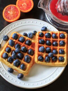 Belgian Waffles made healthy with split red lentils, blood orange juice and blueberries. Breakfast doesn't get any better than this!