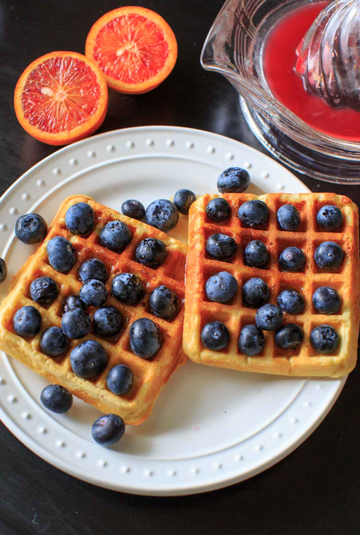 Belgian Waffles made healthy with split red lentils, blood orange juice and blueberries. Breakfast doesn't get any better than this!