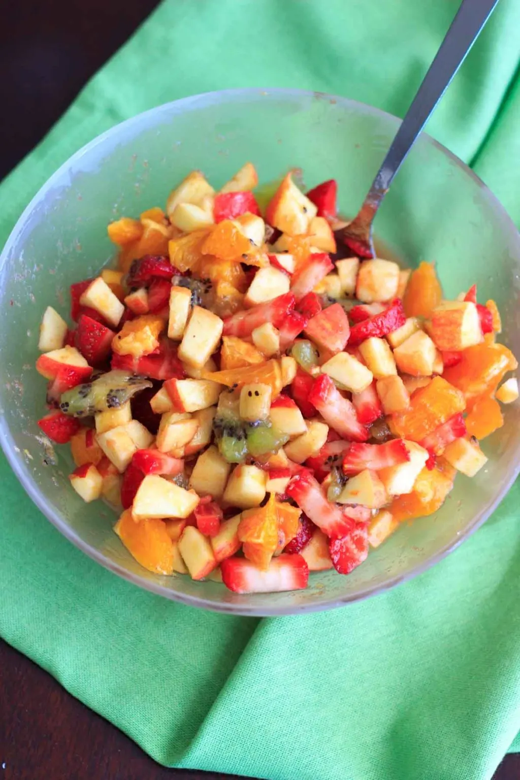 close up of cut up fruit salsa in clear serving bowl