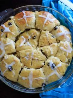 Hot Cross Buns with added dark chocolate pieces, dried cherries, and/or raisins.