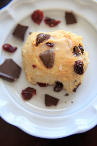 Hot cross buns with dark chocolate pieces and dried cherries.