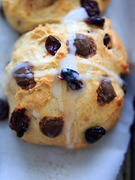 Hot Cross Buns with added dark chocolate pieces, dried cherries, and/or raisins. Traditionally eaten on Good Friday before Easter, these spiced sweet rolls will be a holiday hit.