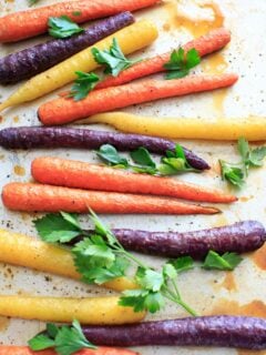 Maple roasted carrots are an easy vegetable side dish that you can throw together for any meal. Vegan and gluten-free, 5 ingredients or less. (Picture is after roasting with fresh parsley.)