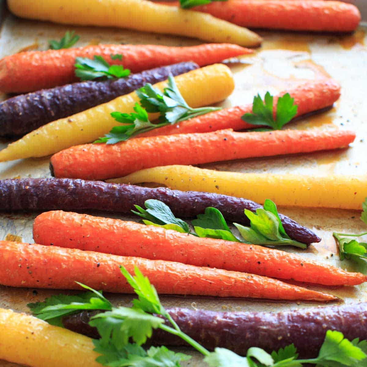 Maple roasted carrots on baking sheet