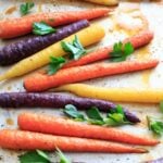 Maple roasted carrots are an easy vegetable side dish that you can throw together for any meal. Vegan and gluten-free, 5 ingredients or less. (Picture is after roasting with fresh parsley, final.)