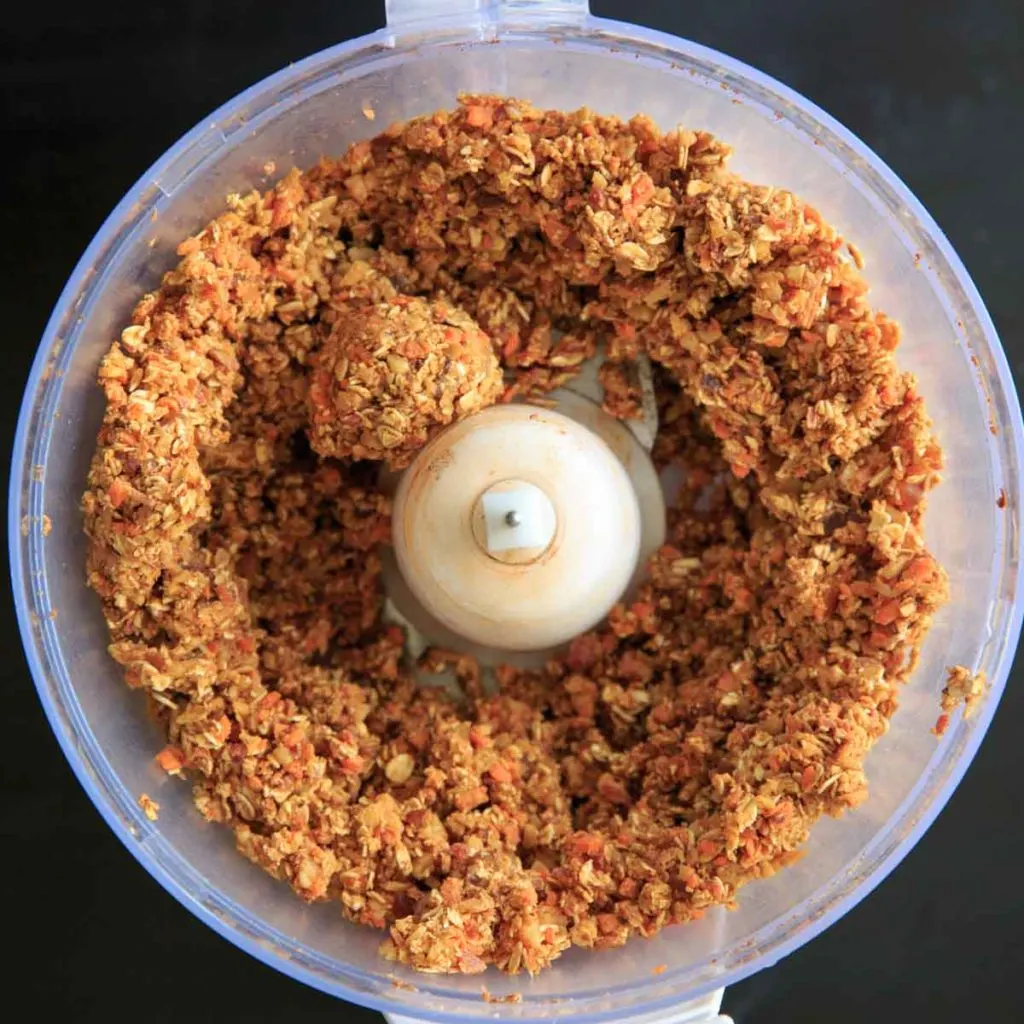 mixing ingredients from carrot cake energy dessert balls in food processor