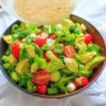 This cucumber avocado salad with miso vinaigrette is full of greens and veggies that can be eaten by itself (for gluten-free) or over a bed of farro for a heartier meal. Either way is a delicious vegan dish that is healthy and full of flavor!