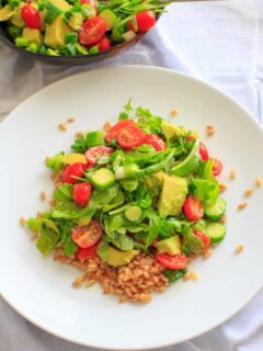 This cucumber avocado salad with miso vinaigrette is full of greens and veggies that can be eaten by itself (for gluten-free) or over a bed of farro for a heartier meal. Either way is a delicious vegan dish that is healthy and full of flavor!