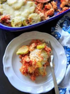 Zucchini Pasta Casserole with thyme. A super easy and healthy casserole that is easily gluten-free. With few ingredients (5 ingredients or less), dinner will be on the table in no time! Picture is plated single serving with full casserole in background.
