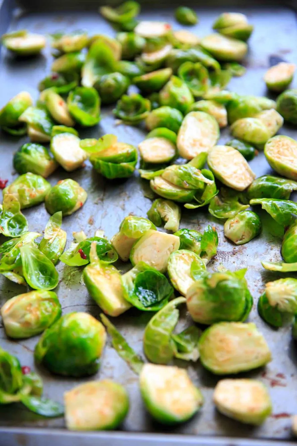 Bang Bang Brussels Sprouts. Easy and spicy side to liven up your veggies. (Pictured is raw brussels sprouts combined with sauces.)