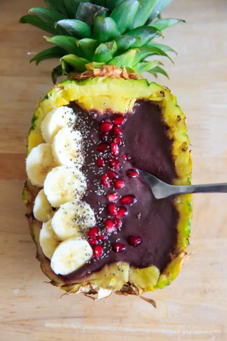 Pineapple Acai Smoothie Bowl or Boat. Lots of tropical fruit vibes and a handful of greens make this smoothie a refreshing treat! Superfoods + optional protein.