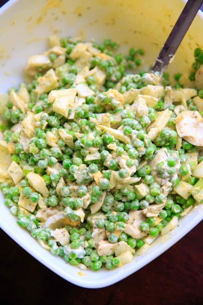 close up of pea salad with hard boiled eggs