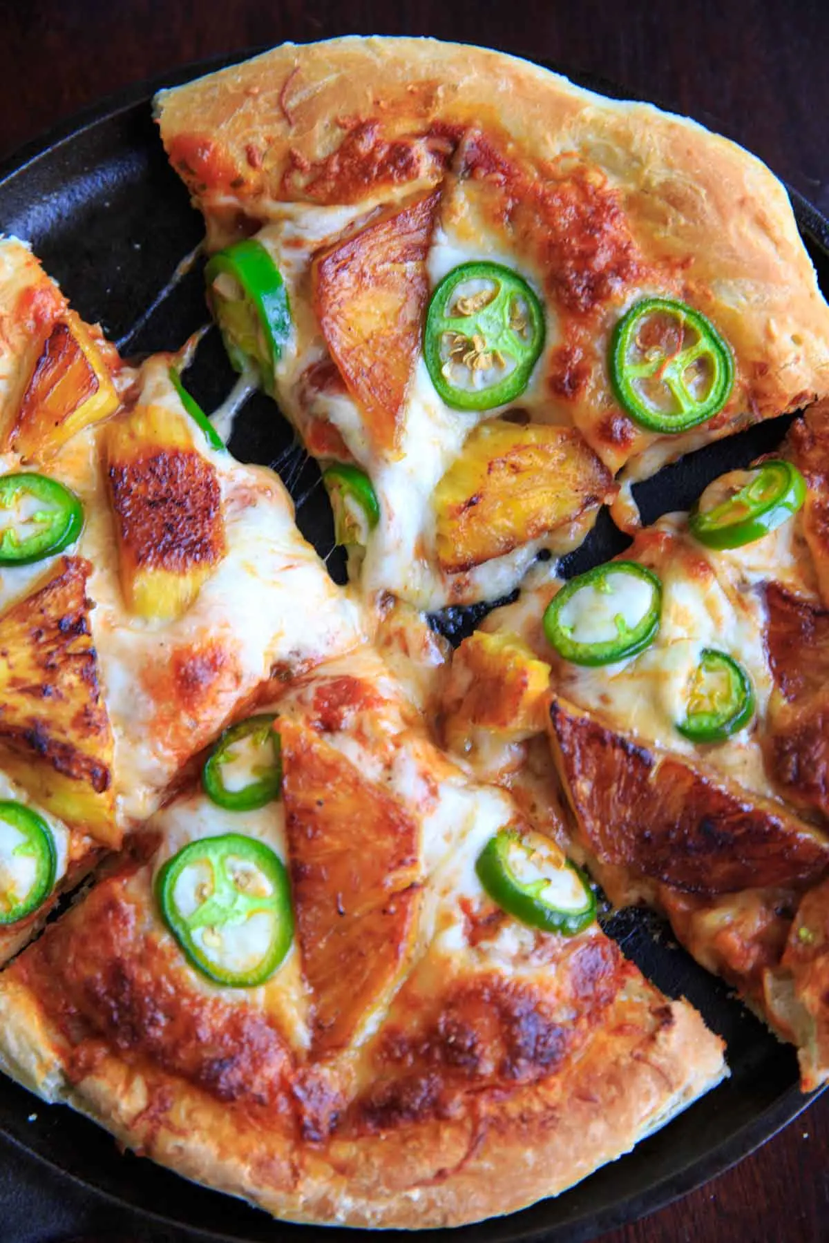 Grilled pineapple and jalapeno pizza. Sweet and spicy combo for people who like pizza with a twist!