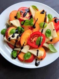 Peach Caprese Salad is a wonderful summer side dish, appetizer or even a meal! Mozzarella cheese, tomatoes, peaches and basil makes a fresh and satisfying dish.